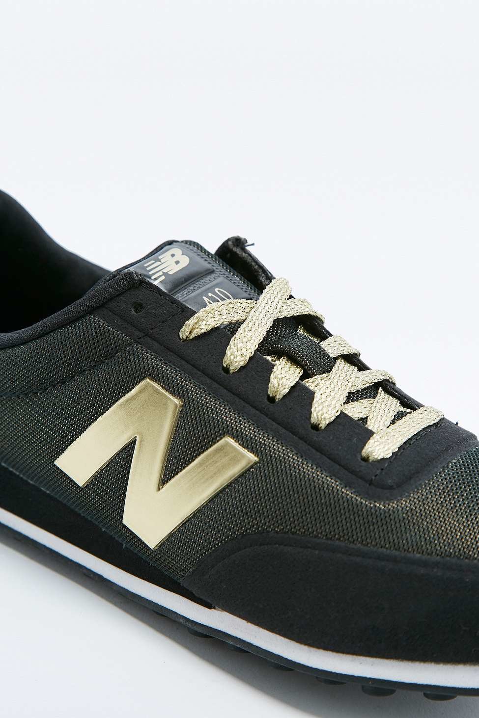 new balance 410 womens black and gold