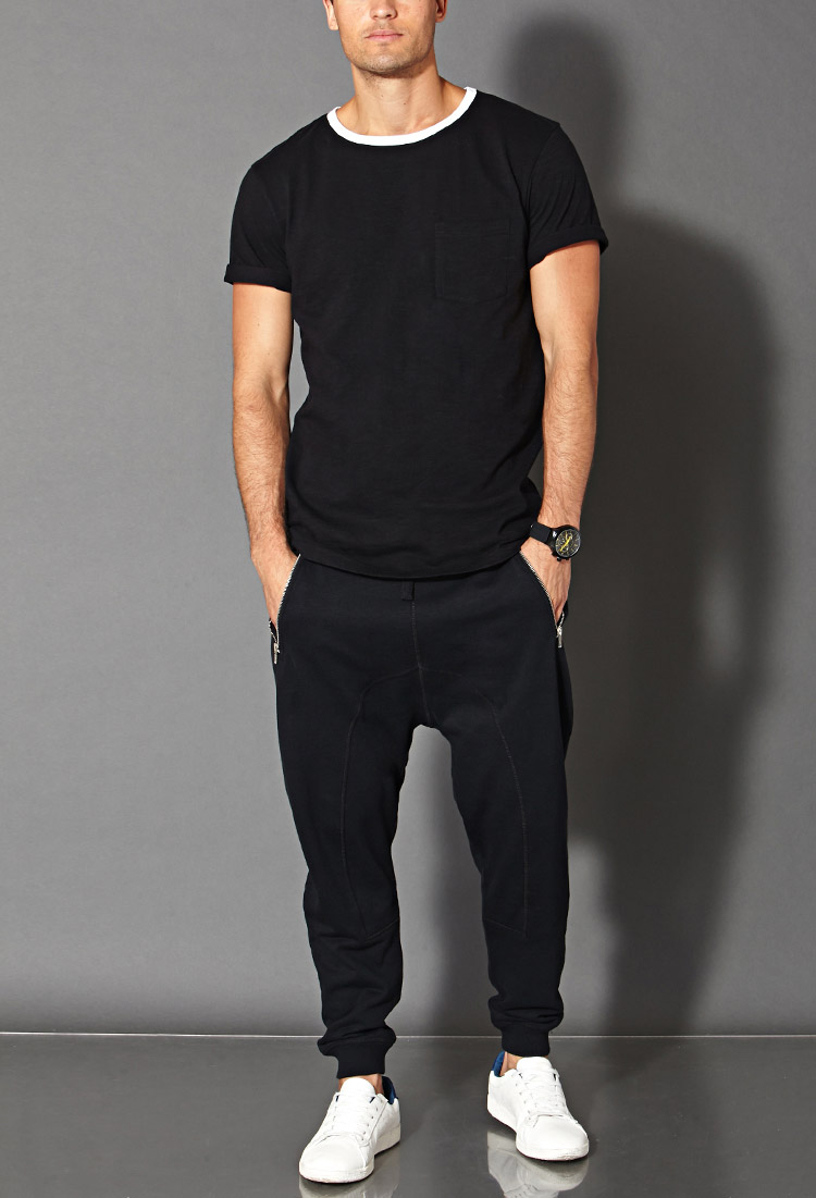 black joggers and black shirt