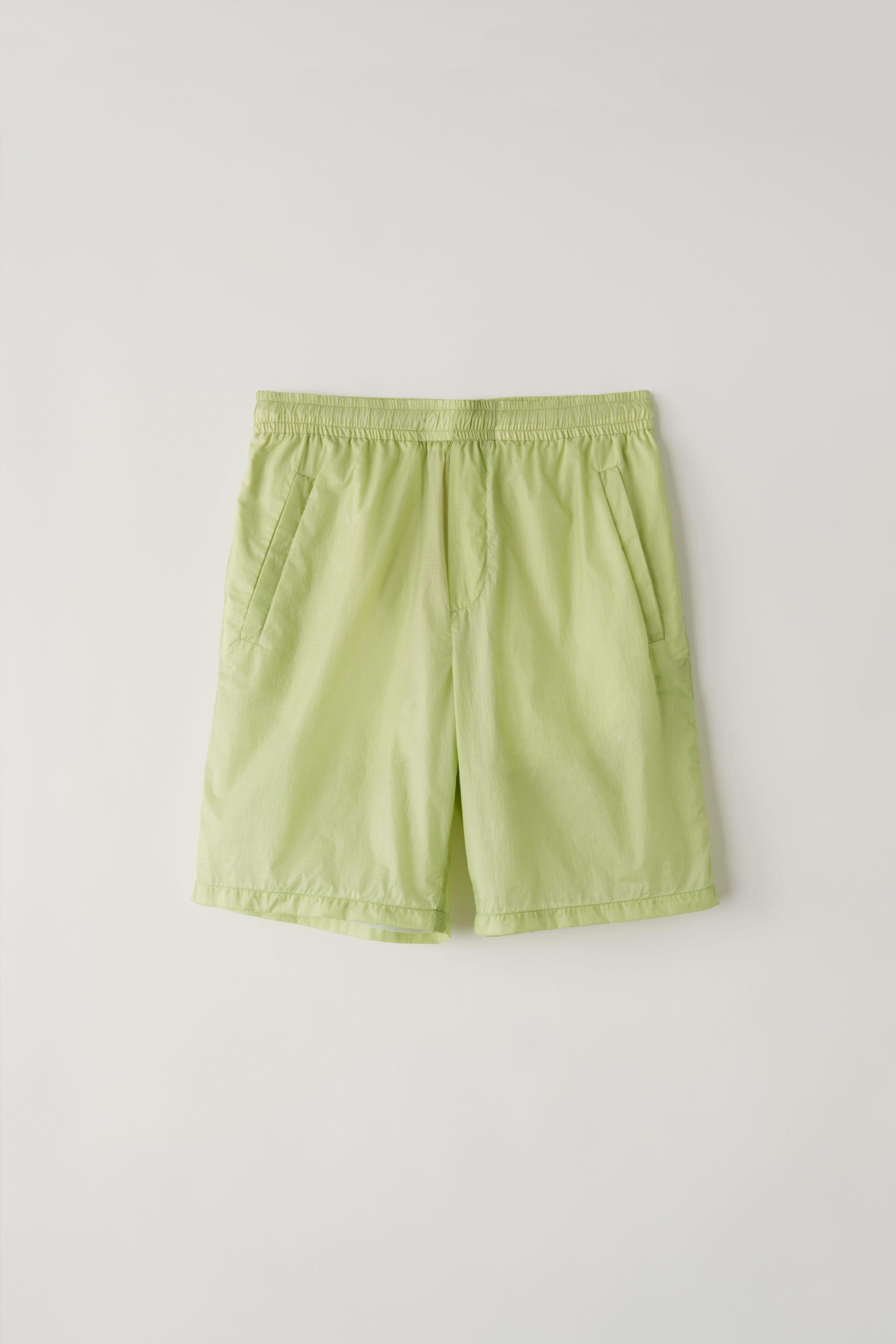 green nylon shorts