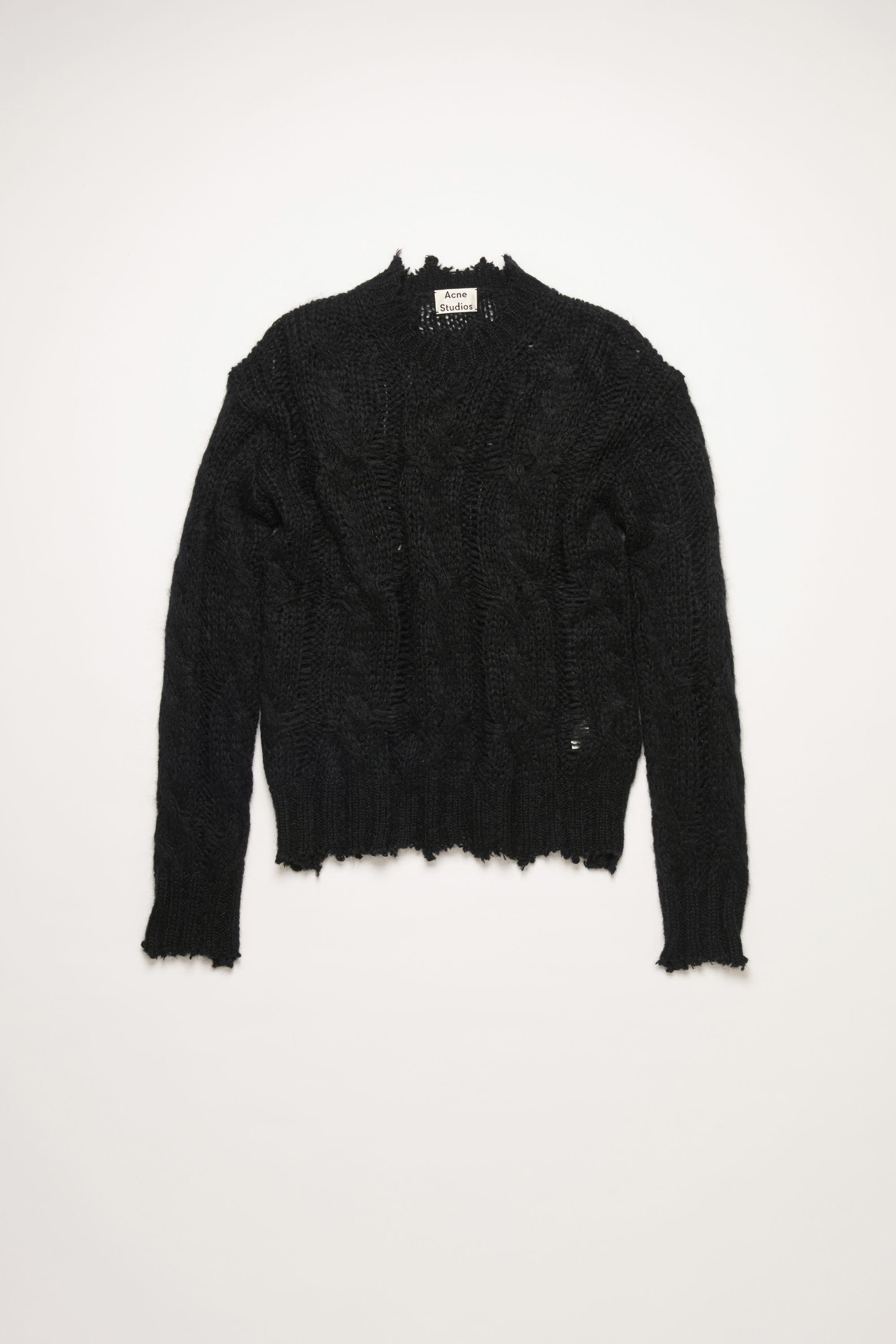 frayed black sweater