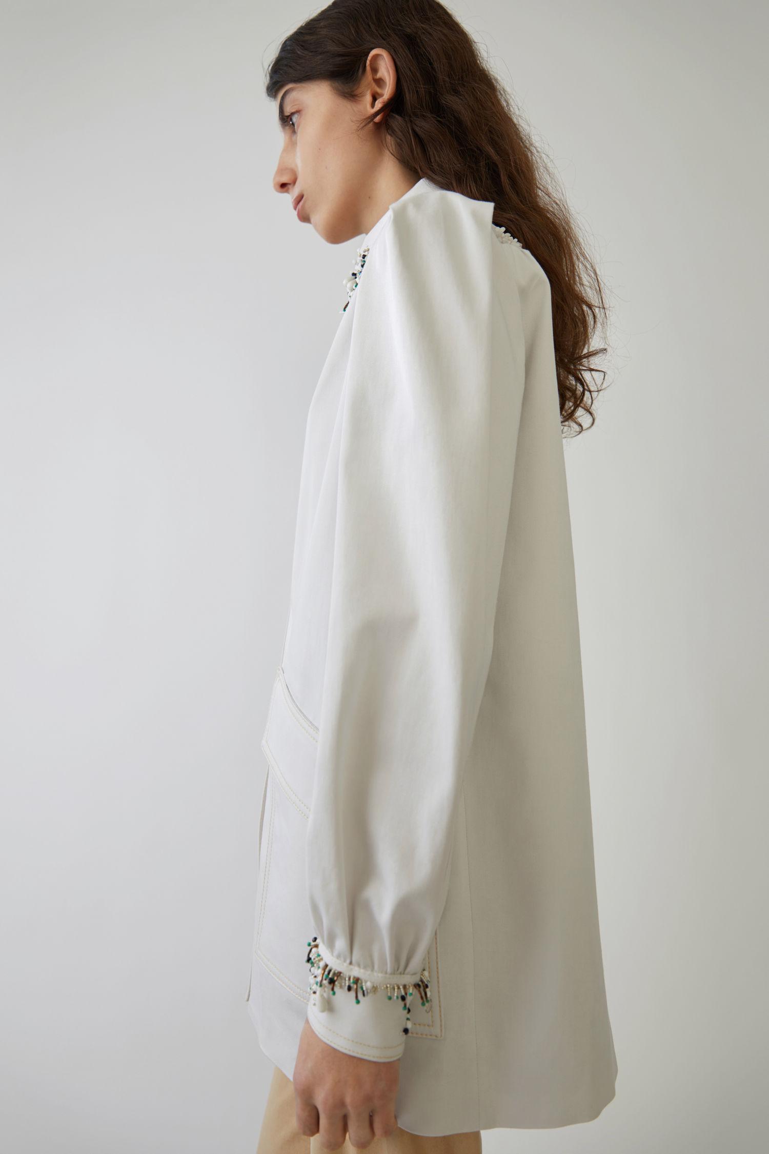 white beaded jacket