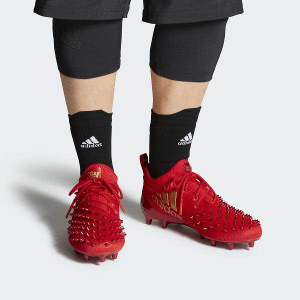 red spike adidas cleats
