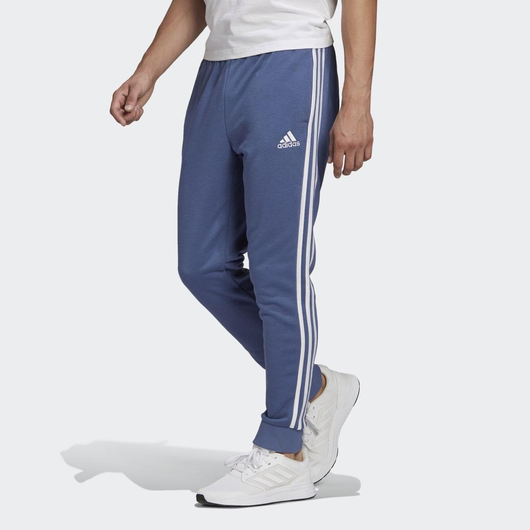 Training adidas Baumwolle Essentials French Terry Tapered Cuff 3-Streifen Hose in Blau für Herren und Fitnesskleidung Jogginghosen Herren Bekleidung Sport- 