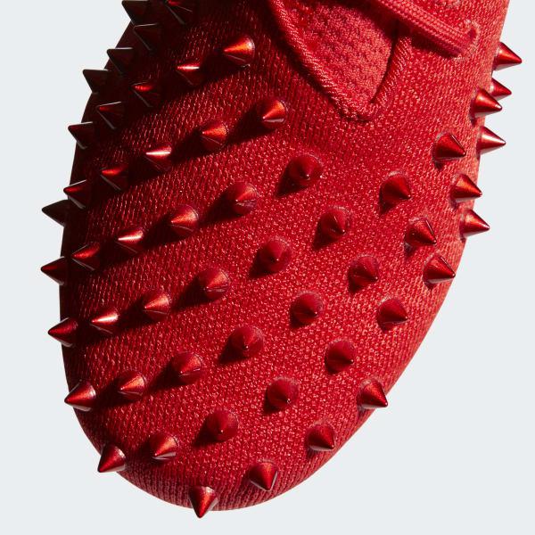 red spike adidas cleats