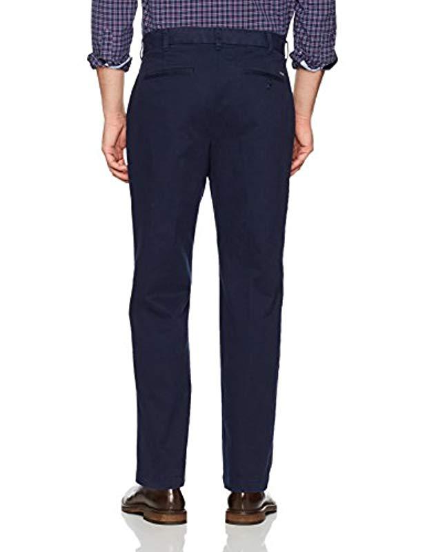 Izod Advantage Performance Flat Front Straight Fit Chino Pant in Navy