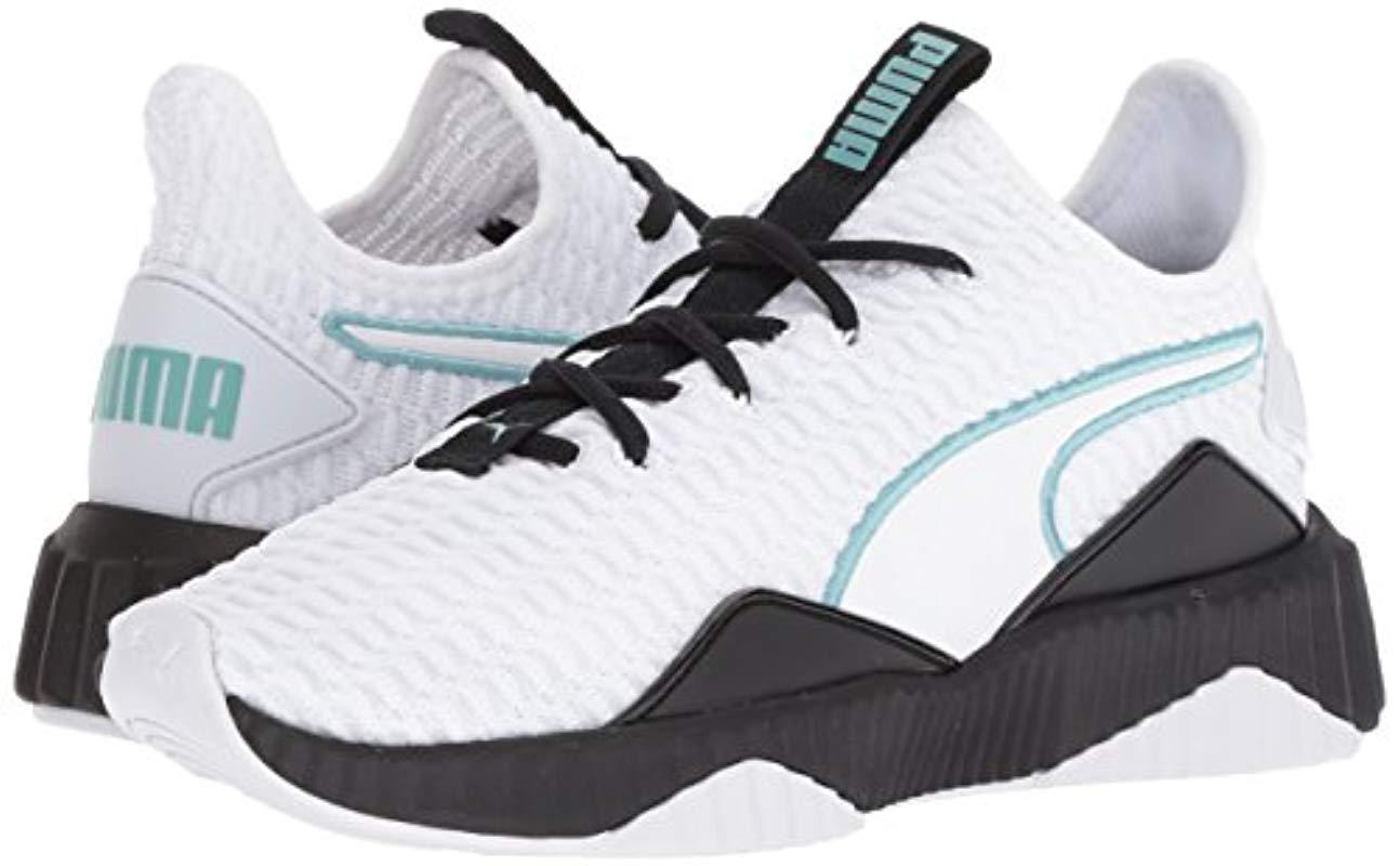 puma defy varsity white
