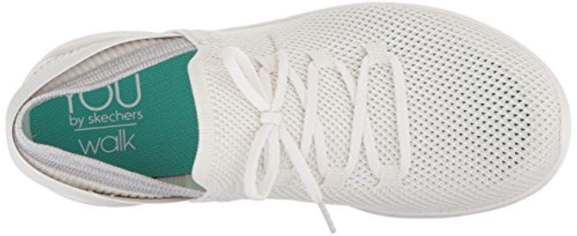 white skechers slip on trainers