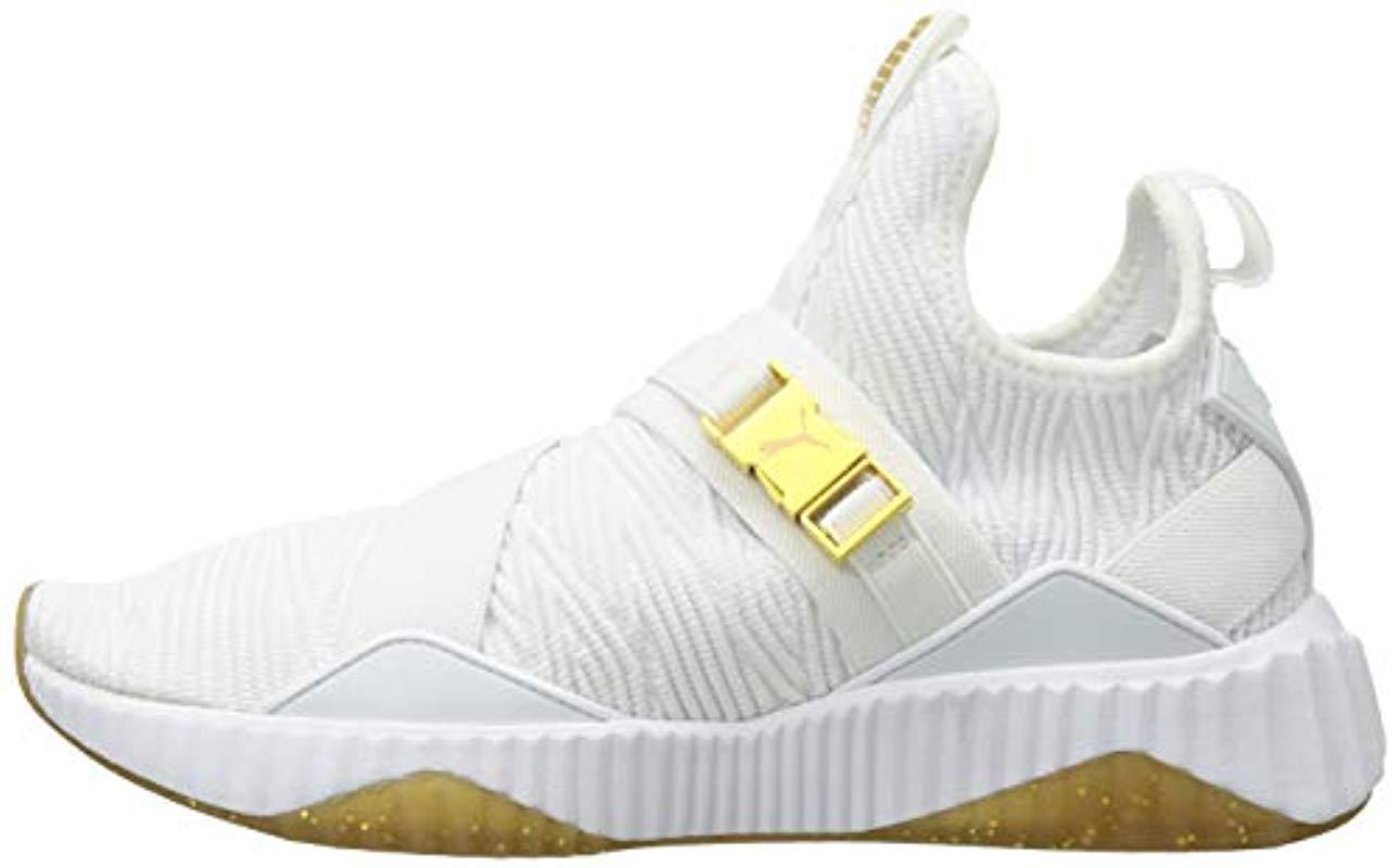 puma defy sneakers in white