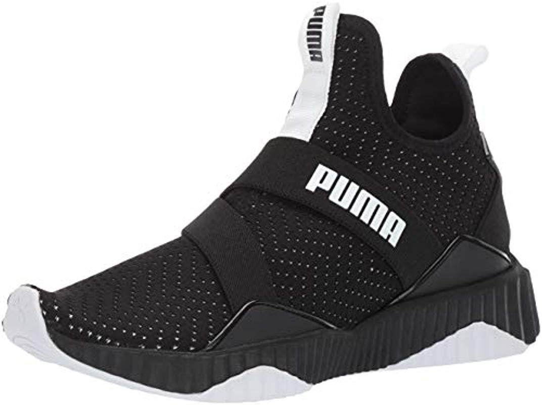 PUMA Defy Mid Core Shoes in Black | Lyst