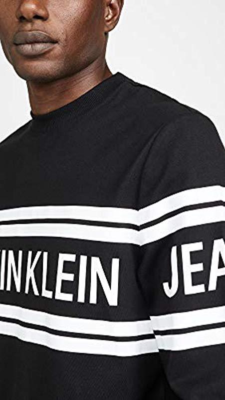 Calvin Klein Jeans Varsity Traveling Logo Long Sleeve Tee in Black