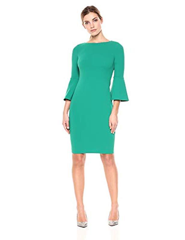 Lyst Calvin Klein 3/4 Peplum Sleeve Sheath Dress in Green