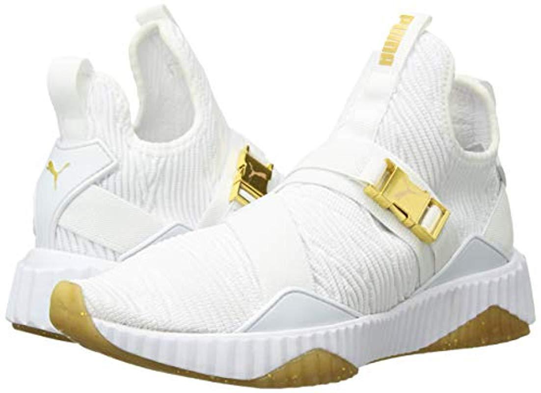 puma defy sneakers in white