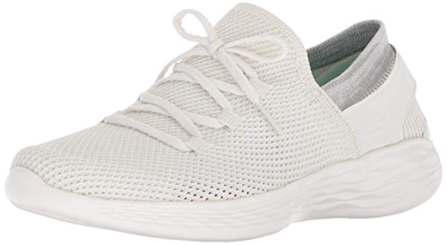 white skechers slip on trainers
