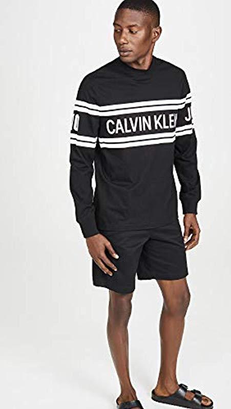 Calvin Klein Jeans Varsity Traveling Logo Long Sleeve Tee in Black for Men  | Lyst