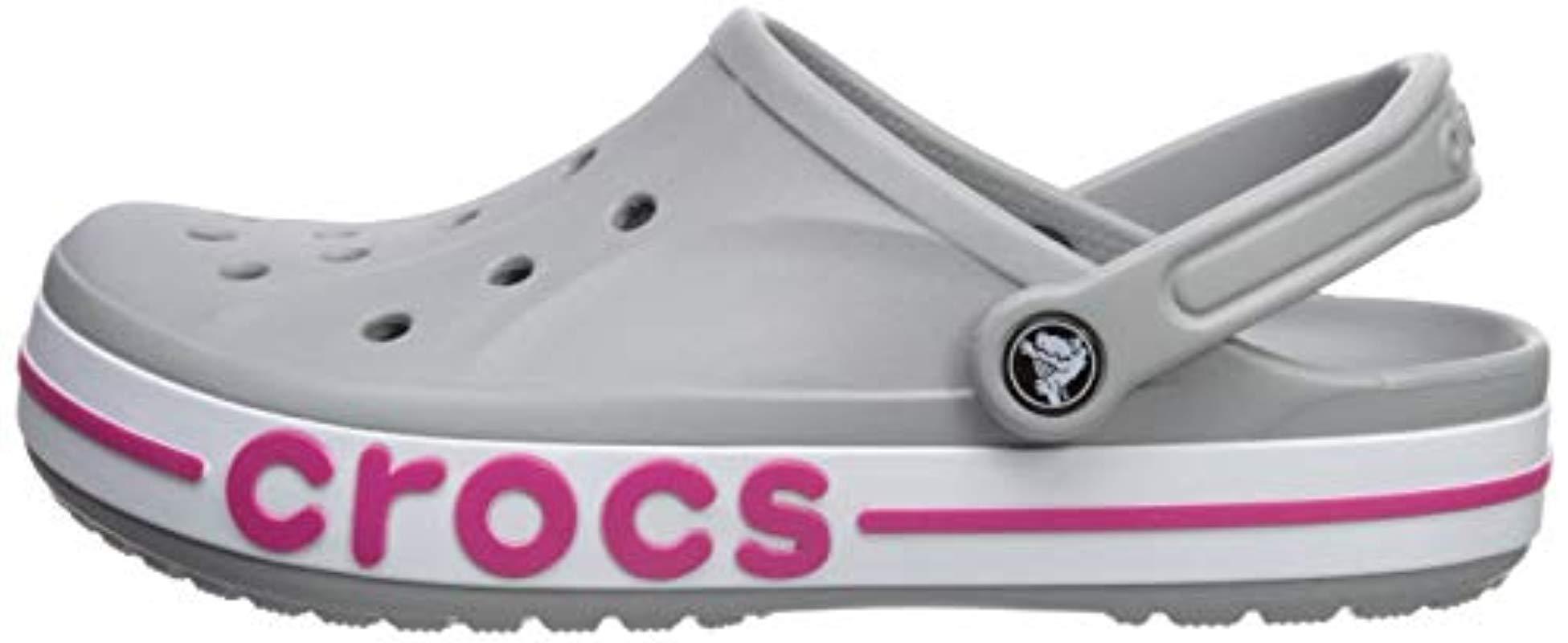 grey and pink crocs