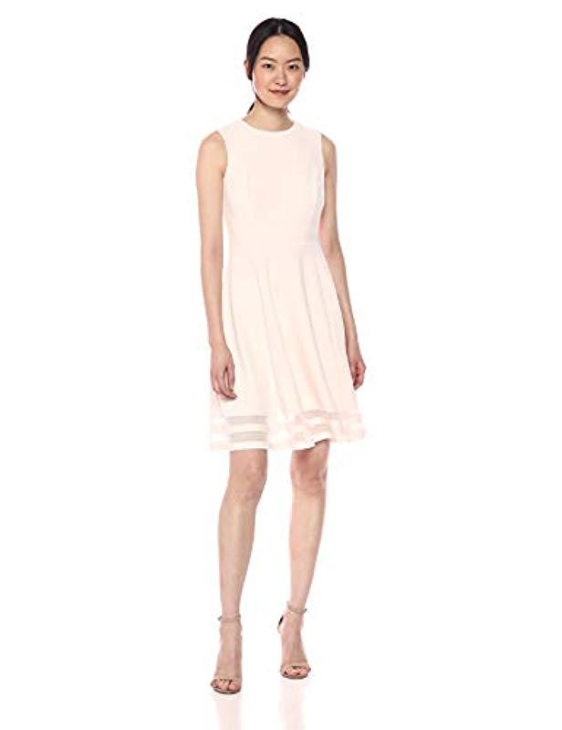 calvin klein women's sleeveless round neck fit and flare dress with sheer inserts