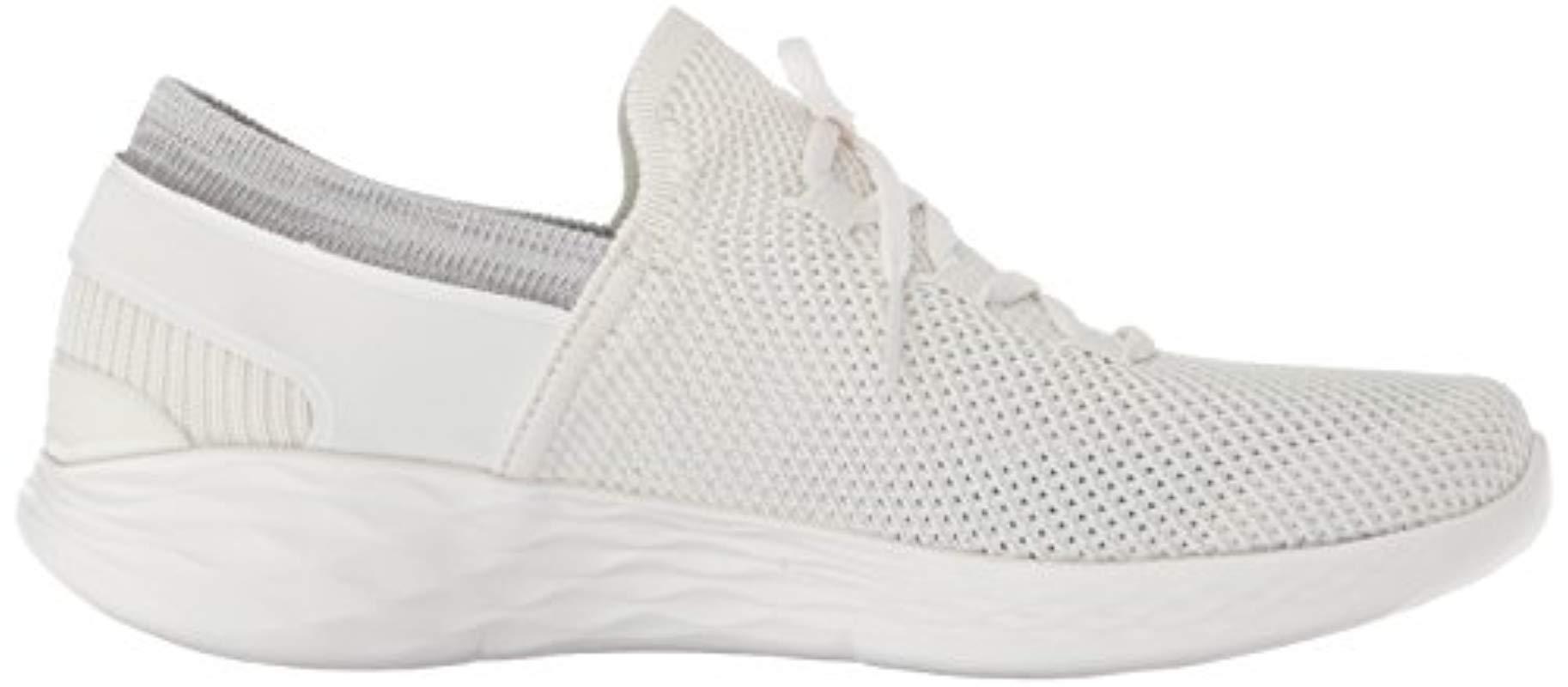 white skechers slip on trainers