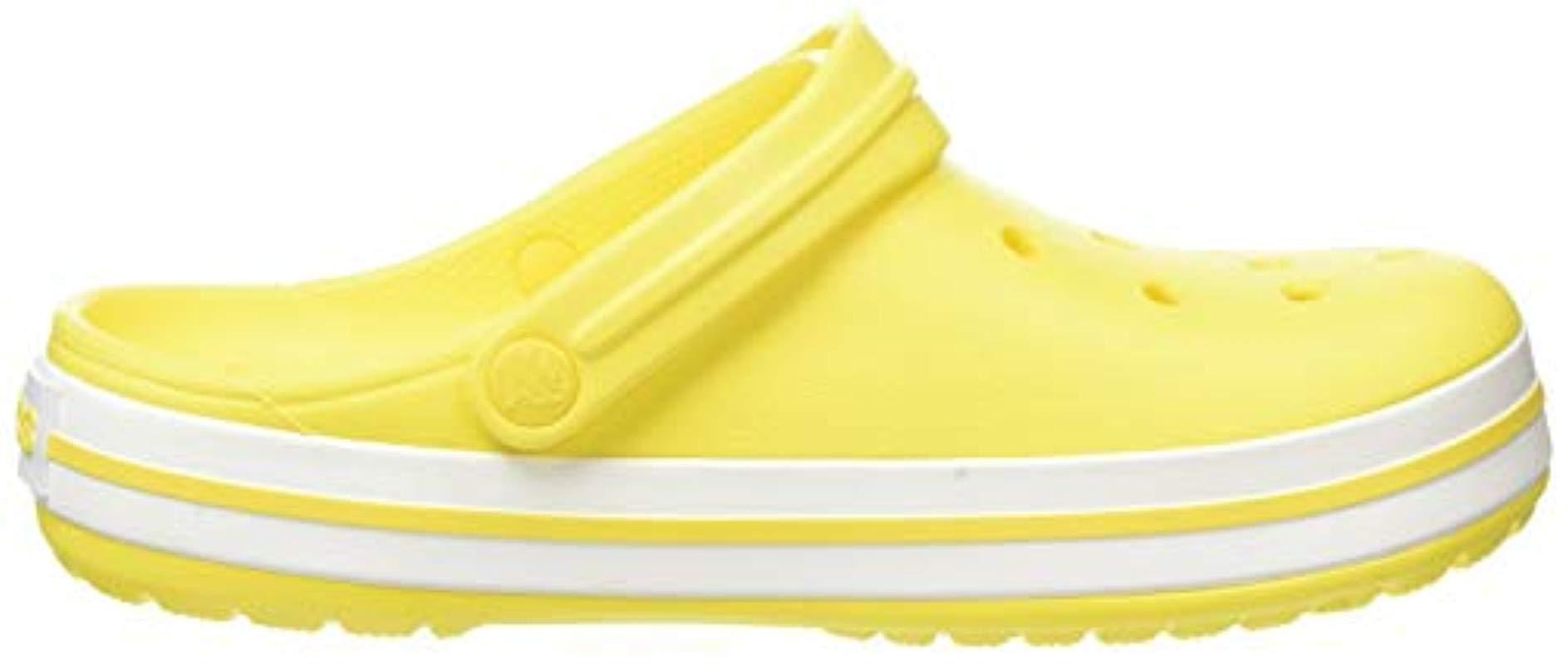 yellow and white crocs
