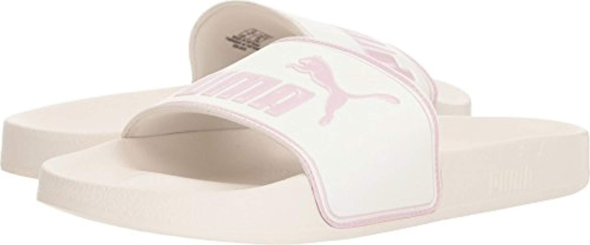 pink and white puma slides