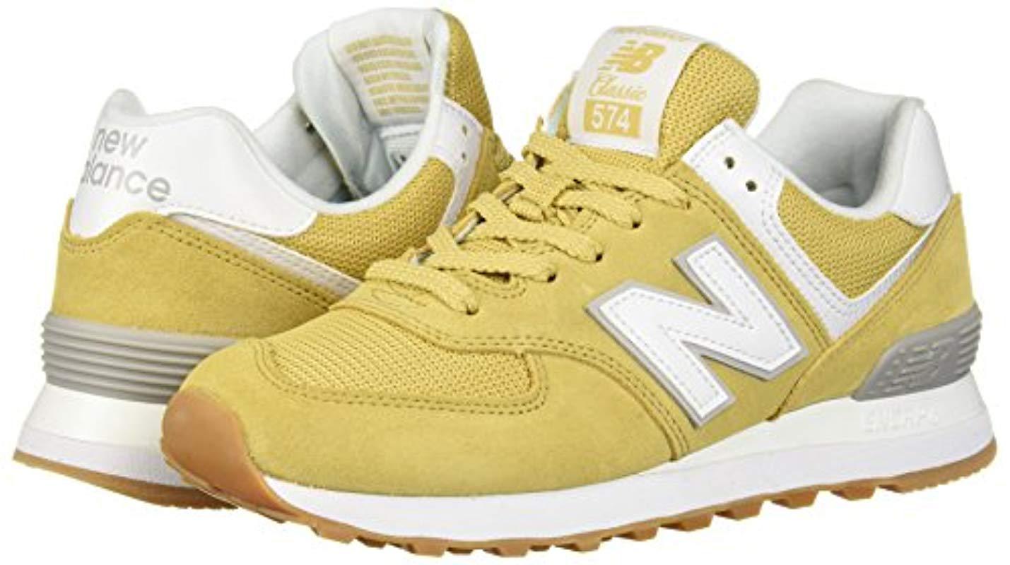 new balance 574 burgundy yellow