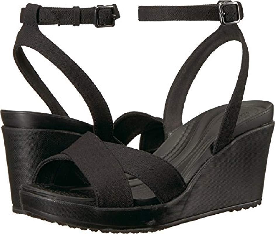 Crocs™ Women's Leigh Ii Cross-strap Ankle Wedge in Black | Lyst