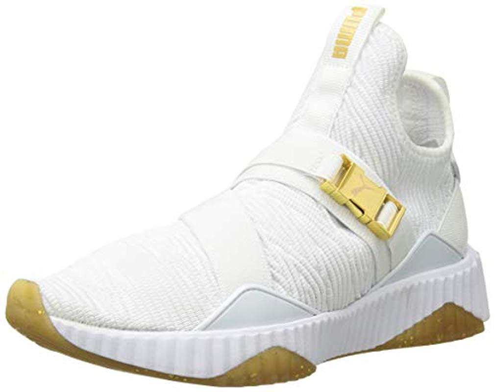 puma defy sneakers in white