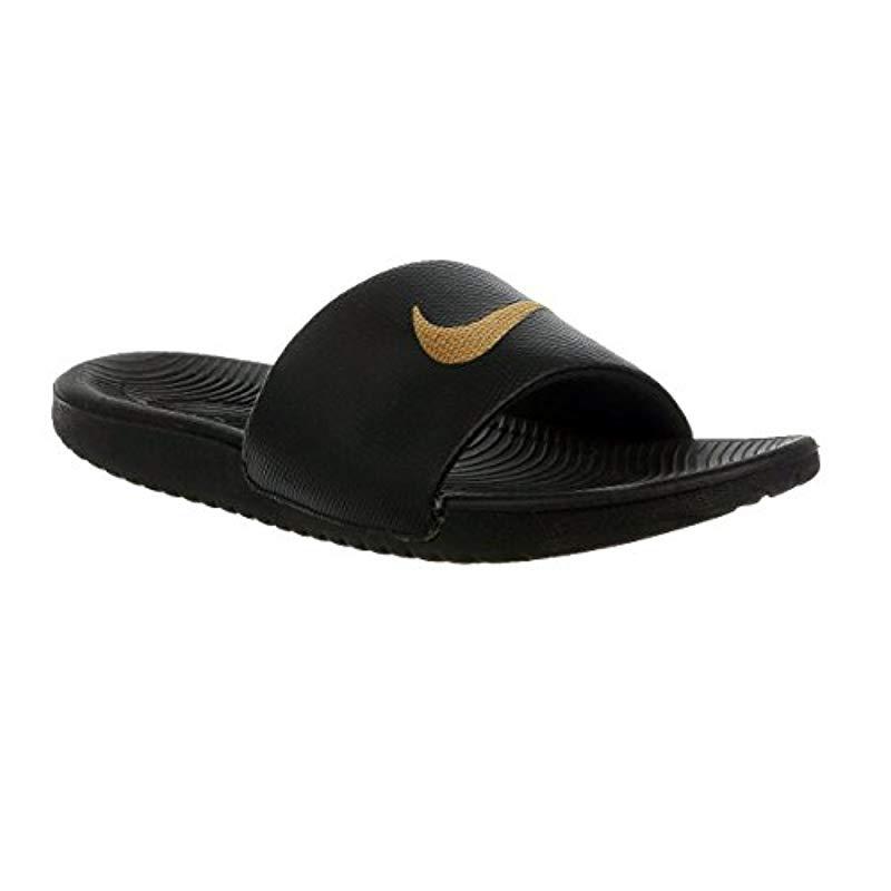 nike kawa slides black and gold