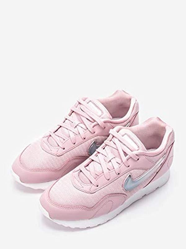 nike outburst trainers in white and pink