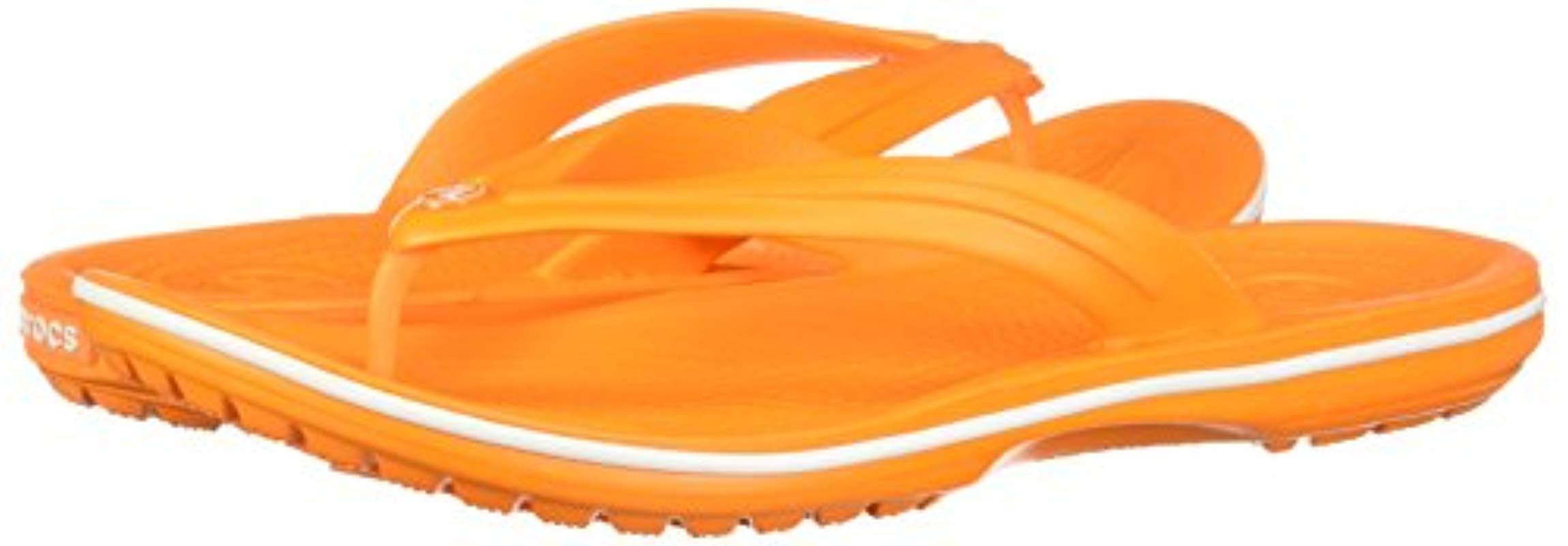 Orange croc flip flops on sale