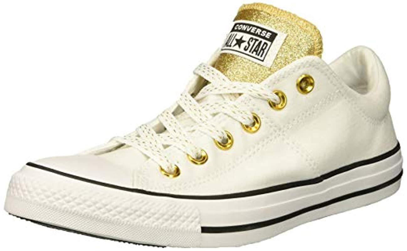 gold low top converse