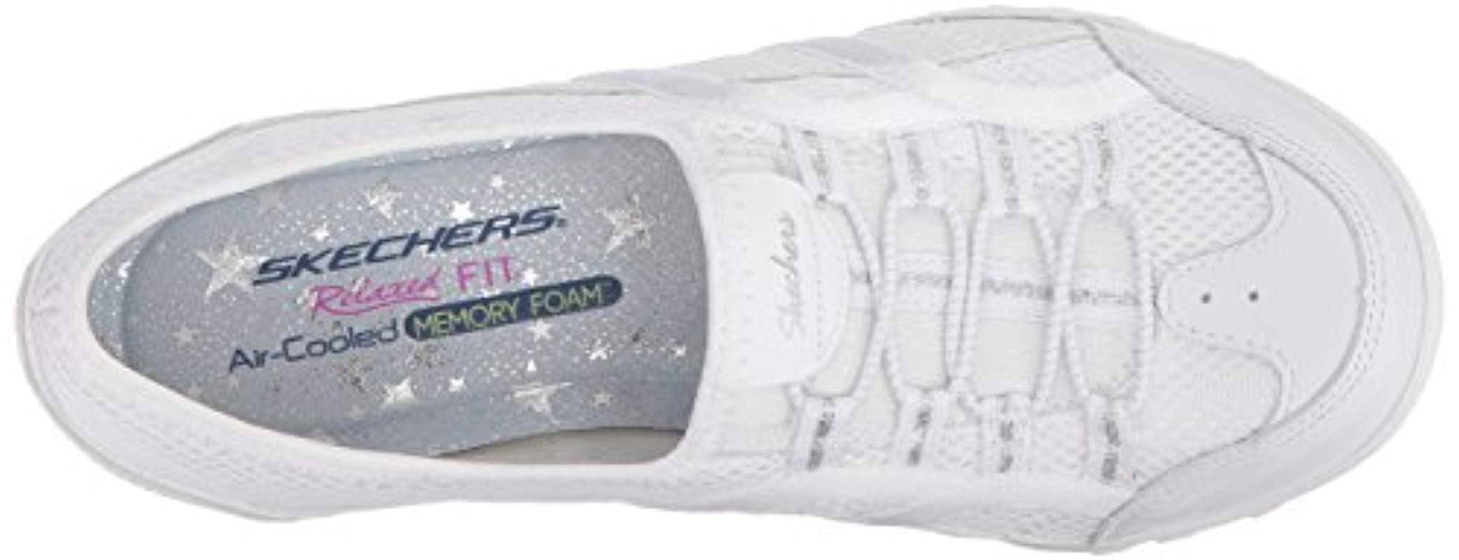 white skechers slip on trainers