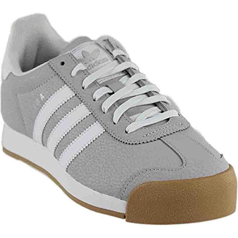 grey and white adidas samoa