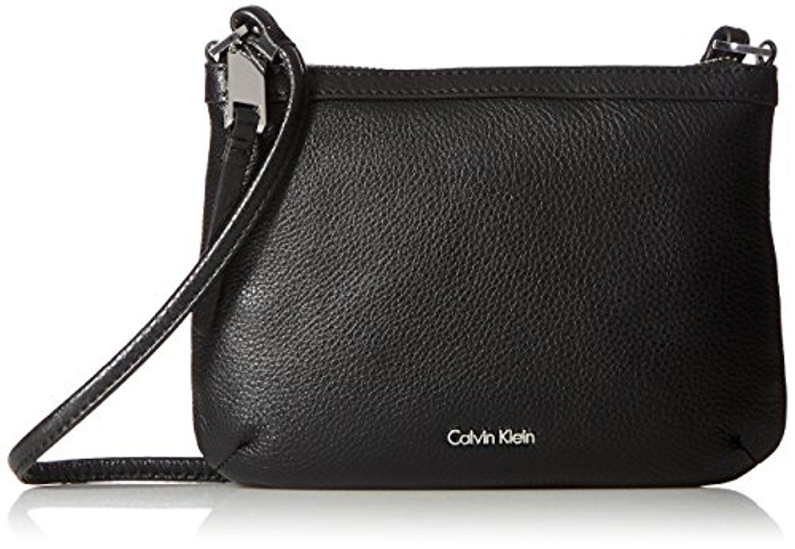 Calvin Klein Small Pebble Leather Crossbody in Black | Lyst