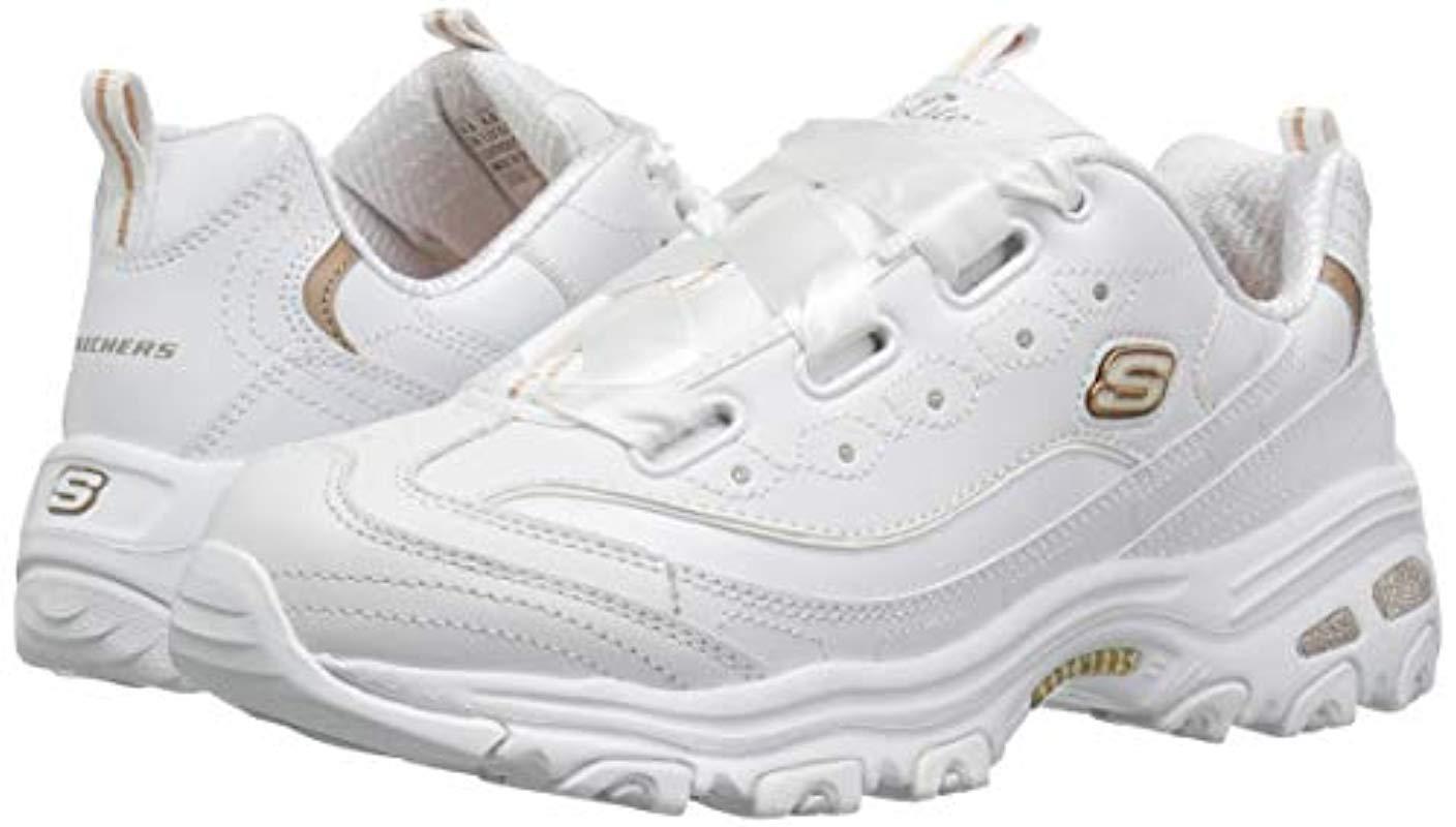 white and gold skechers