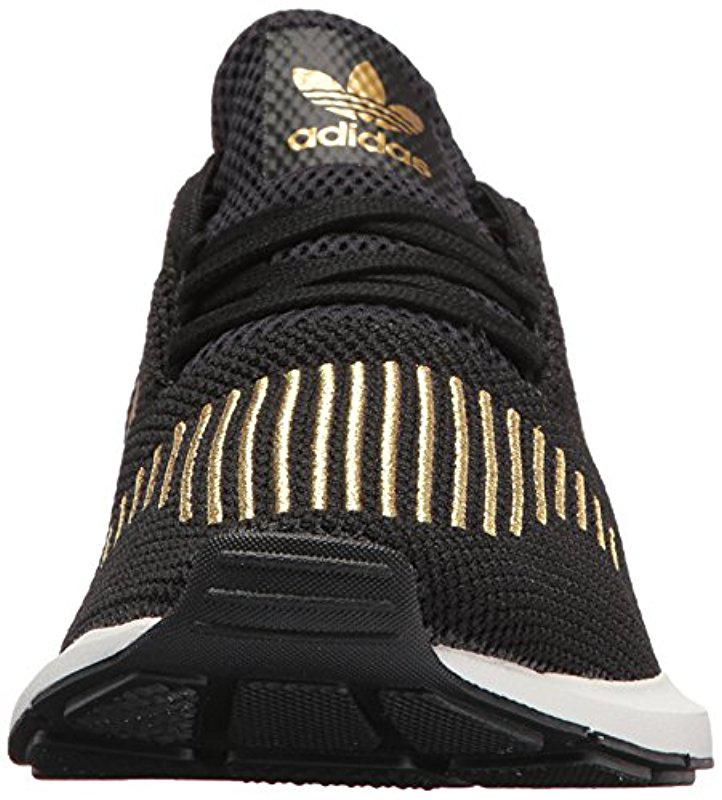 black and gold swift run adidas