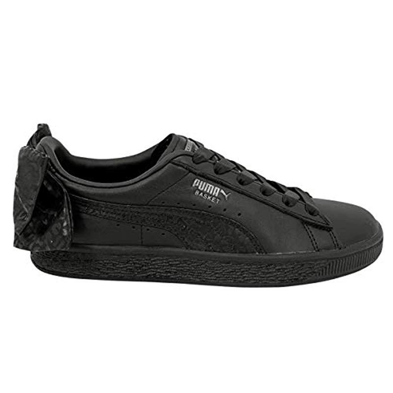 black puma trainers with bow