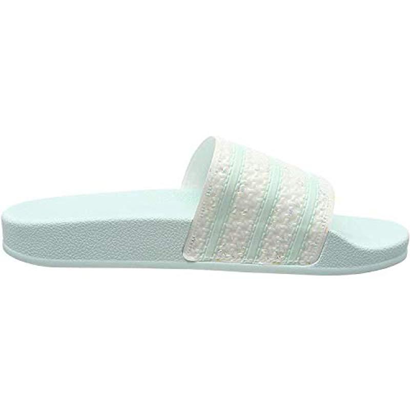 mint green adidas slides
