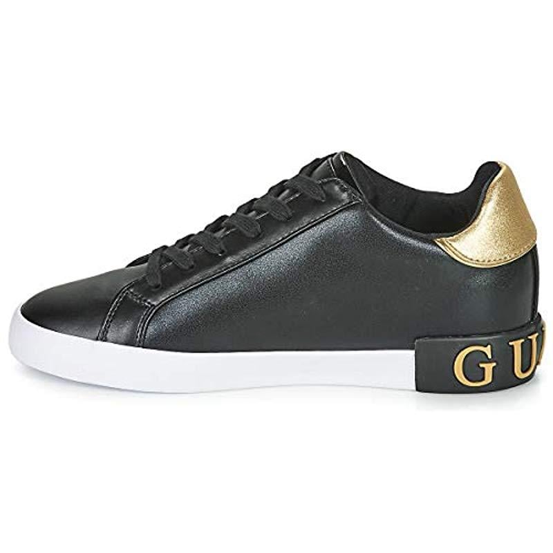 black and gold guess trainers