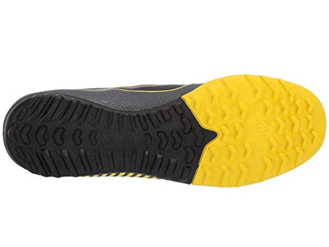 grey and yellow nike boots