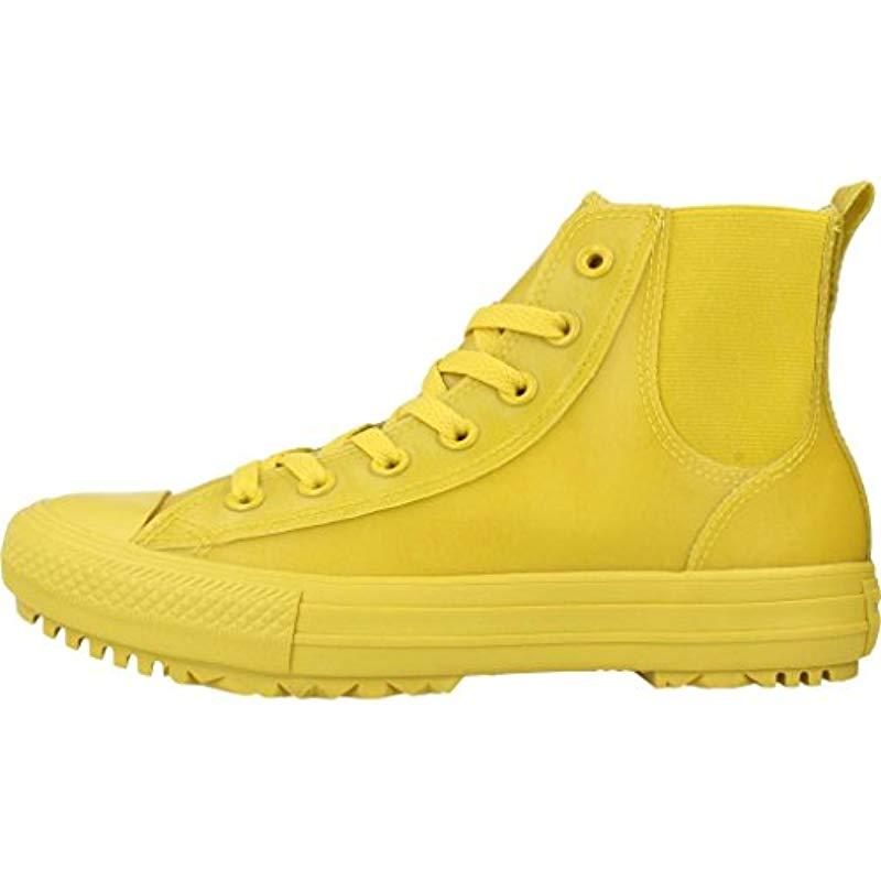 converse yellow chelsea rubber hi trainers