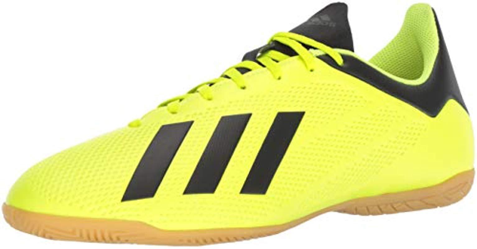 yellow adidas soccer shoes