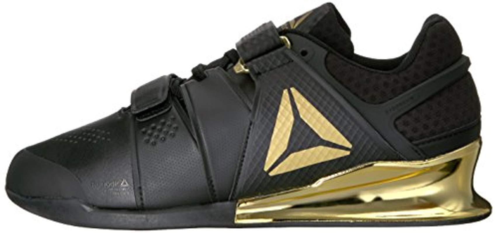 reebok black and gold lifters