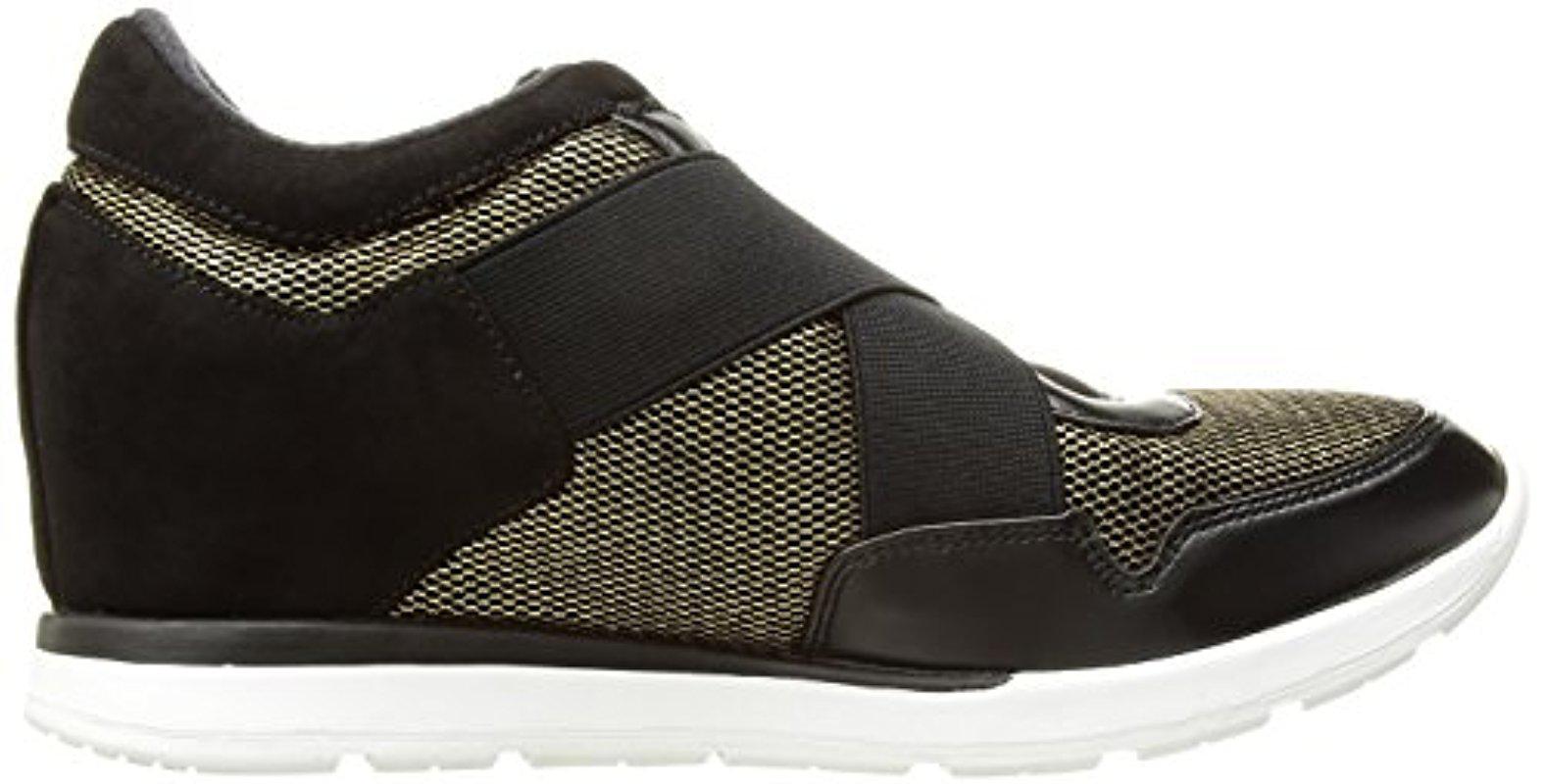 black and gold guess shoes