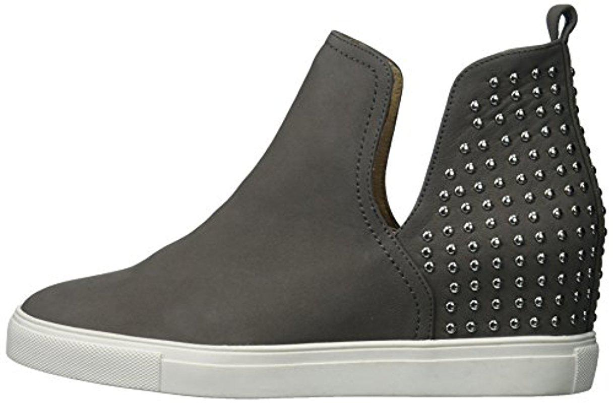 steven by steve madden coin leather and stud wedge sneakers