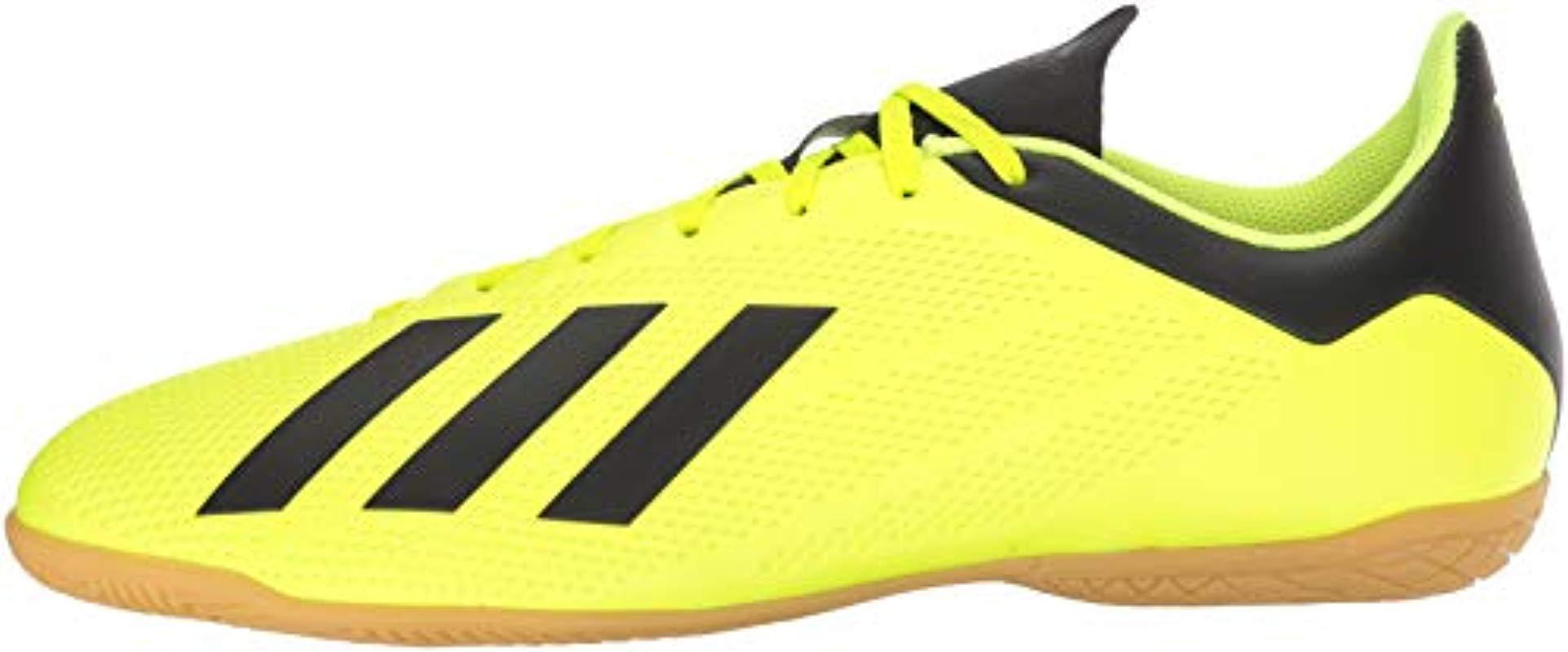 yellow adidas soccer shoes