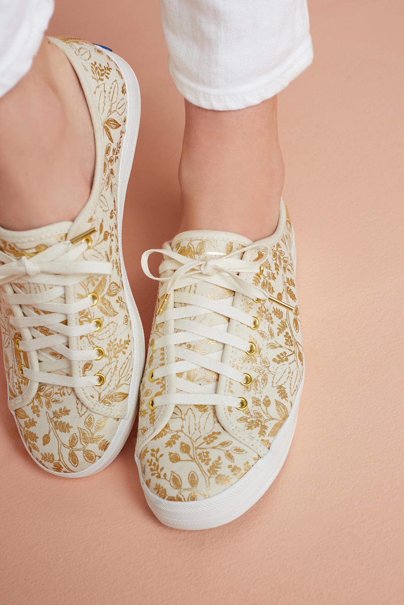 white and gold keds