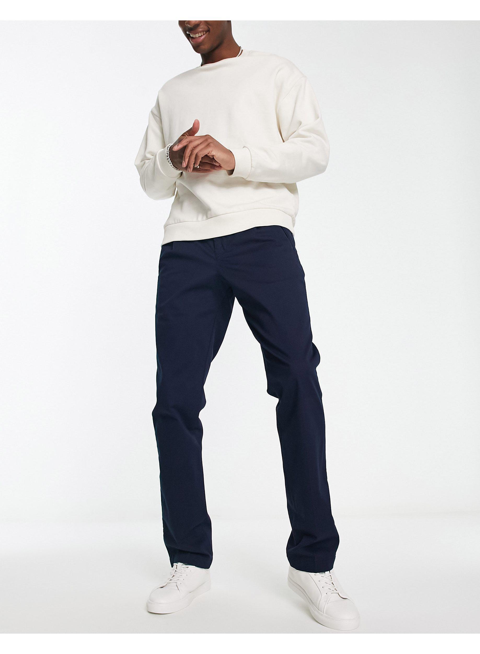 Lacoste Pleated Chinos in Blue for Men | Lyst