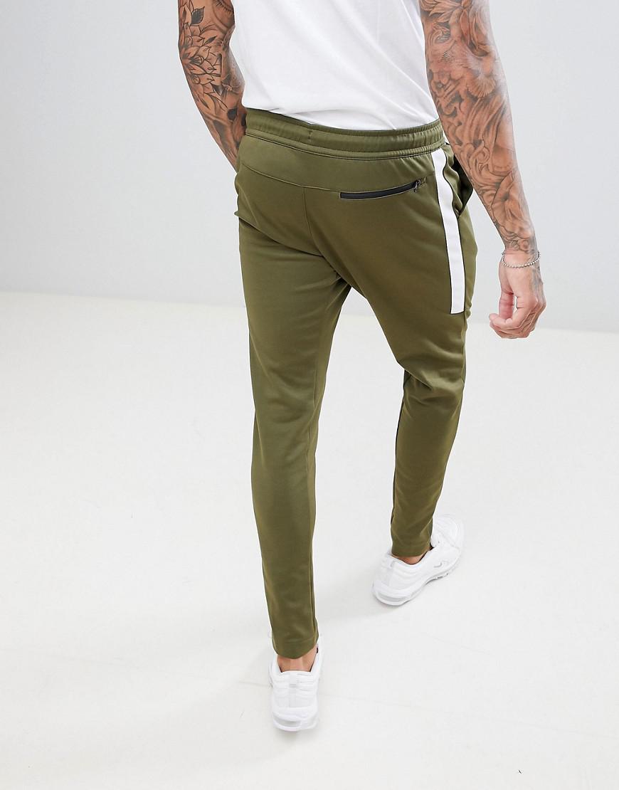 green nike track pants