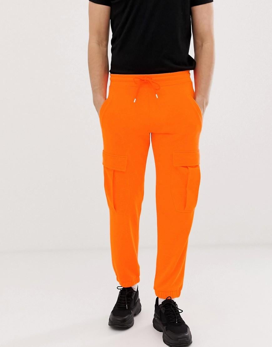 Nike Jogger оранжевые. Оранжевые брюки Nike карго. Оранжевые джоггеры мужские. Штаны женские оранжевые карго. Оранжевые штаны купить