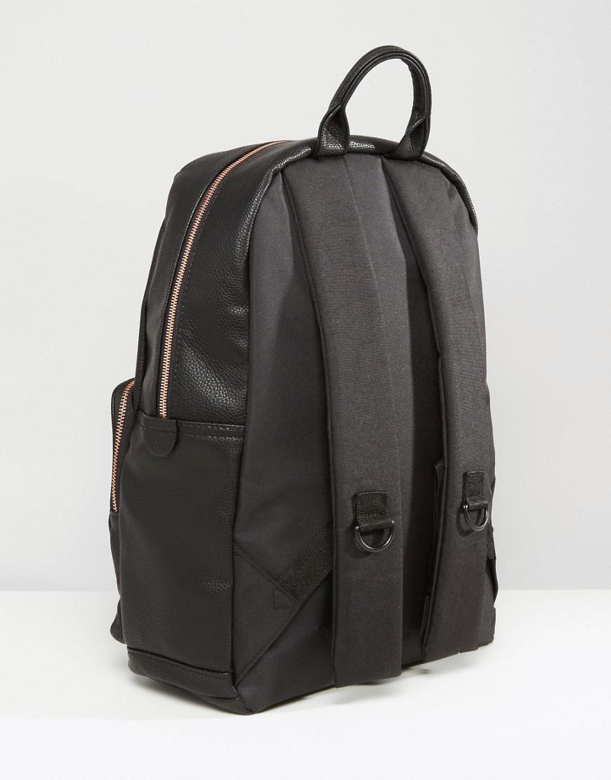 black backpack rose gold zip